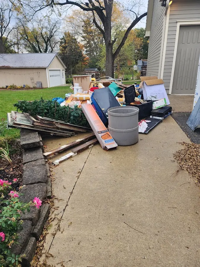 Dumpster being loaded with debris for 3 Yard Dumpster Rental in Tarentum